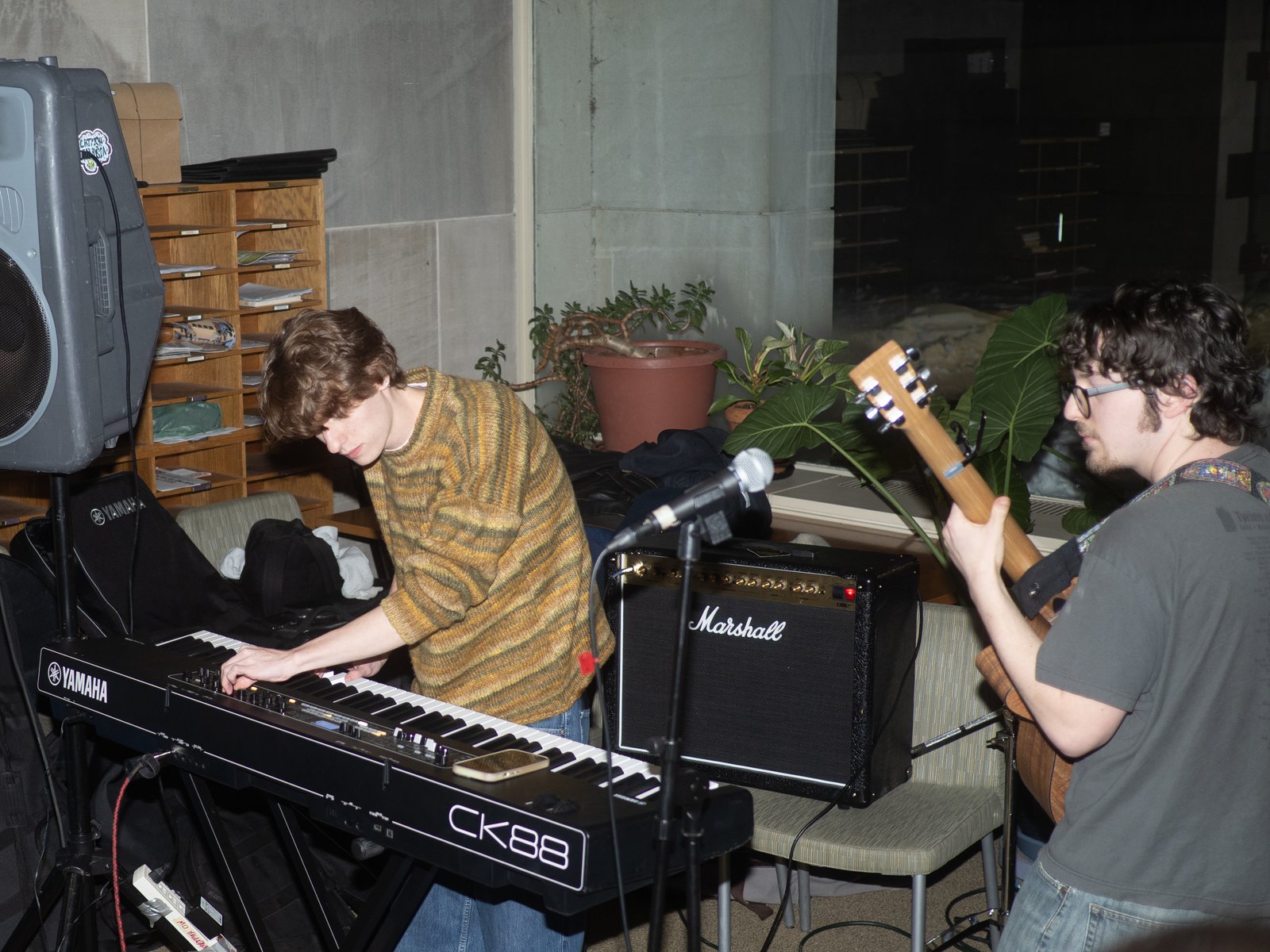 Ezra playing keys on a Yamaha CK88 next to a guitarist playing through a Marshall amp.
